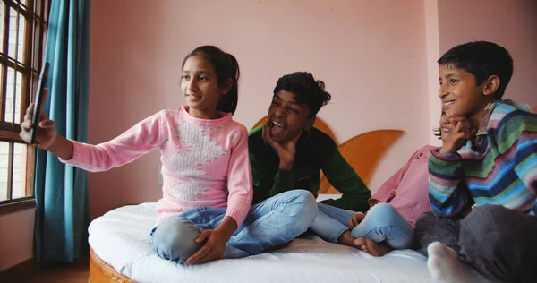 Shallow Focus Four South Asian Siblings Taking Selfie Bedroom — Zdjęcie stockowe