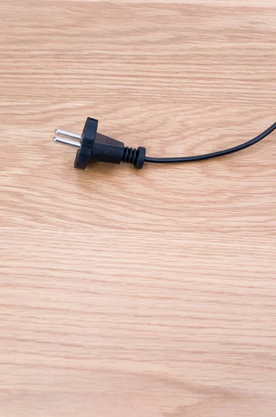 Isolated Electrical Power Cord Plug Wooden Background Copy Space — Stockfoto