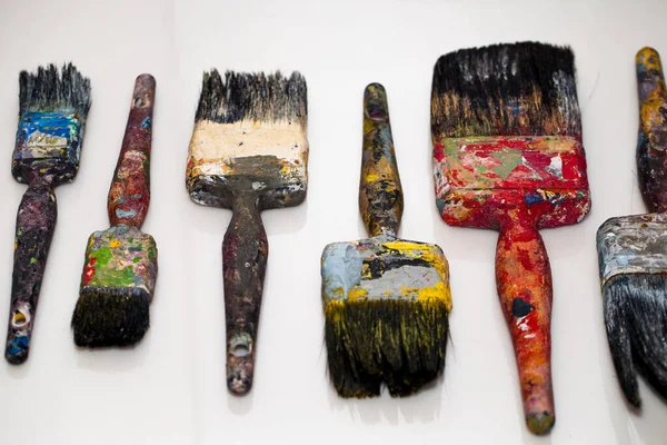 Old Paint Brushes Color Stains White Surface — Stock Photo, Image