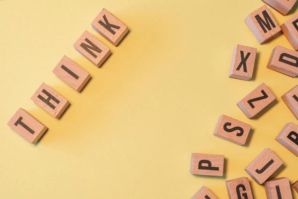Word Think Taken Pile Wooden Letter Blocks Yellow Background Copy — Stock Fotó
