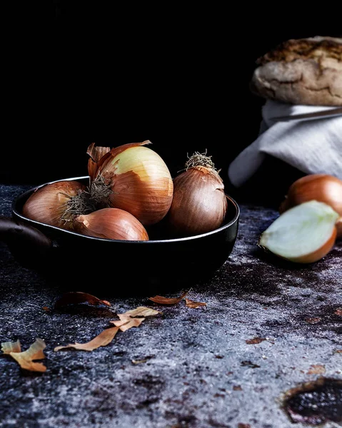 Vertical Closeup Shot Onions Table Black Background — стоковое фото