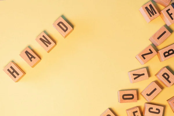 Word Hand Taken Pile Wooden Letter Blocks Yellow Background Copy — Stockfoto