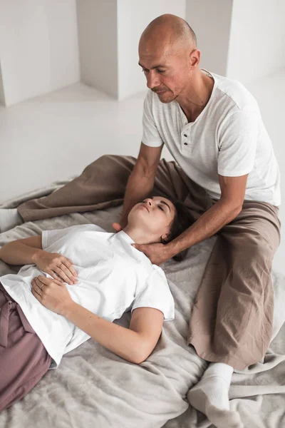Professional Young Man Massaging Woman Neck White Cozy Room Manual —  Fotos de Stock