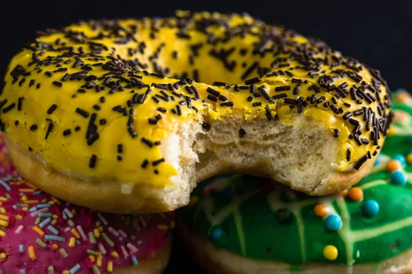 Close Shot Bitten Yellow Glazed Donut Sprinkles — Stockfoto