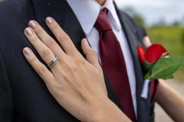 Closeup Shot Bride Hands Wedding Rings Groom Chest Wedding Day — Foto Stock