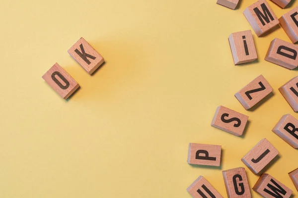 Word Taken Pile Wooden Letter Blocks Yellow Background Copy Space — Fotografia de Stock