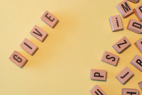 Palavra Dar Tirada Uma Pilha Blocos Letras Madeira Com Fundo — Fotografia de Stock