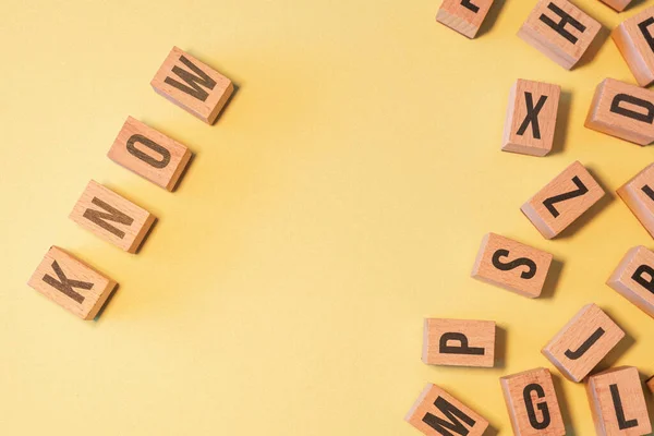 Word Know Taken Pile Wooden Letter Blocks Yellow Background Copy — Stockfoto