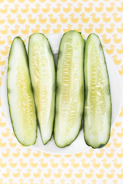 Vertical Top View Sliced Cucumbers Surface Yellow Ducks — Stock Photo, Image