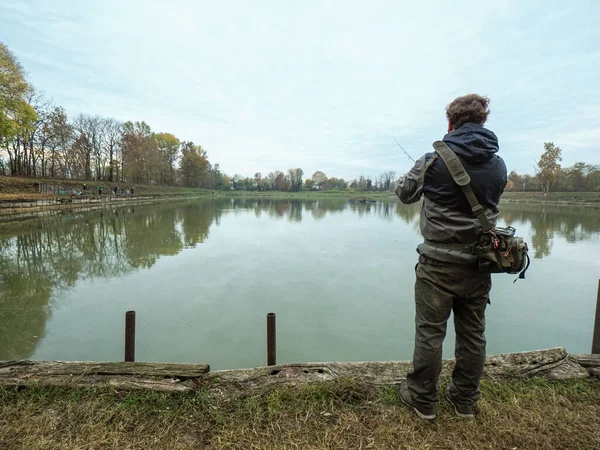 Closeup Shot Man Spin Fishing Artificial Lake — Stockfoto