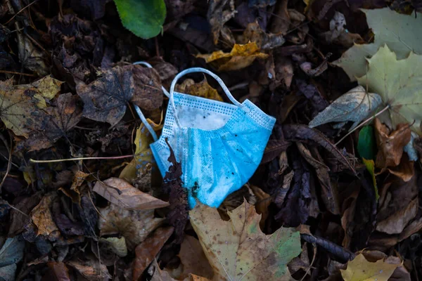 Closeup Used Medical Face Mask Dried Autumn Leaves — Stock Photo, Image