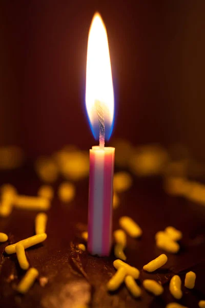 Vertical Shot Lit Candle Wooden Surface — Fotografia de Stock