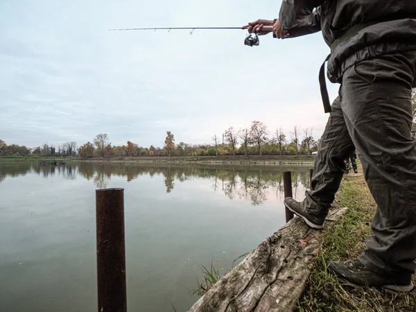 Man Catching Fish Fishing Rod Lake — Stockfoto