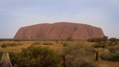 A beautiful view of the Uluru sandstone formation in the Red Center of the Northern Territory of Australia clipart