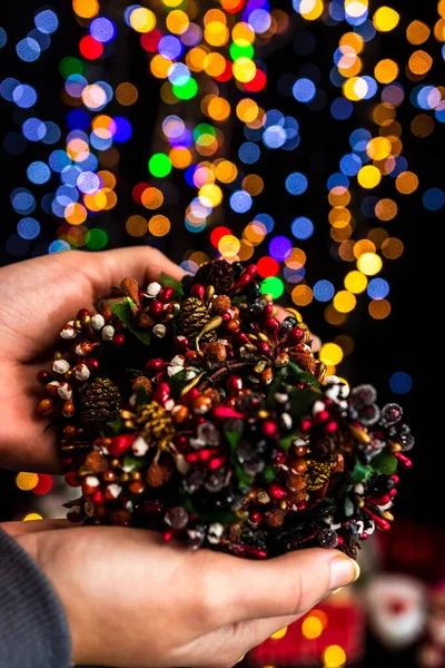 Vertical Shot Person Holding Christmas Decoration Bokeh Lights Background — Stock Photo, Image