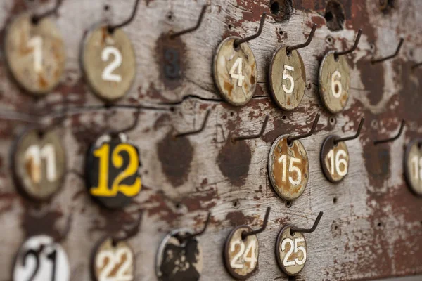 Selective Shot Numbers Hanging Rusty Weathered Board — 图库照片