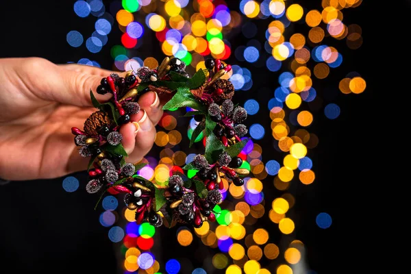 Holding Small Christmas Wreath Colorful Bokeh Lights Background — Stock Photo, Image