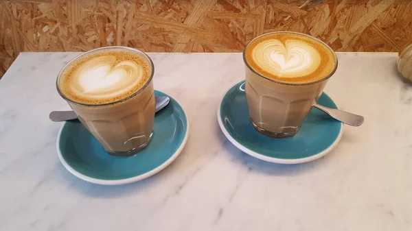 Closeup Shot Two Glass Cups Tasty Cappuccino Small Spoons — Stock Photo, Image