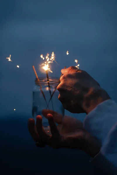 Closeup Shot Fire Sparklers Glass Jar Male Hand Dark Blue — Stockfoto