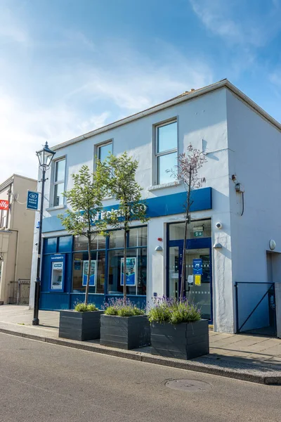 stock image DUBLIN, IRELAND - Jul 24, 2021: A vertical shot of The Bank of Ireland in the Beautiful Dalkey district. Dublin, Ireland