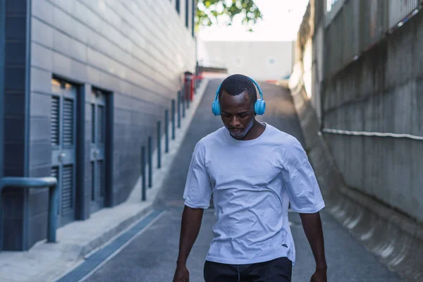 Shot Man White Shirt Listening Music His Blue Headset Street — ストック写真
