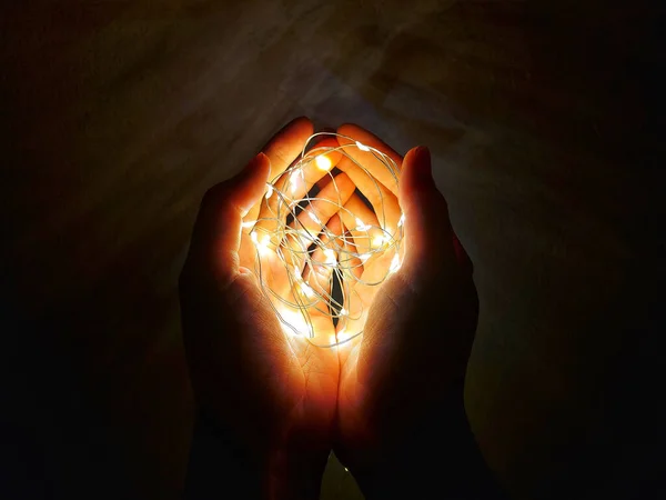 Closeup Hands Holding Decorative Lights — Stock Photo, Image