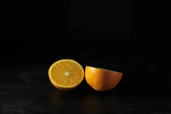 Closeup Beautiful Ripe Orange Halved Black Background — Stock Photo, Image