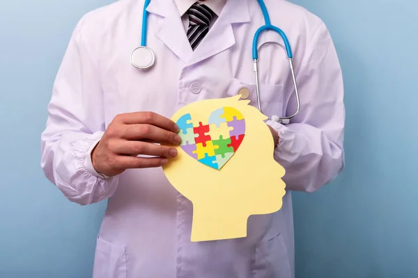 Doctor Holding Head Jigsaw Puzzle Brain Shape Autism Spectrum Disorder — Stock Photo, Image