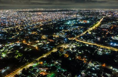 An aerial shot of the city of Accra in Ghana at night clipart