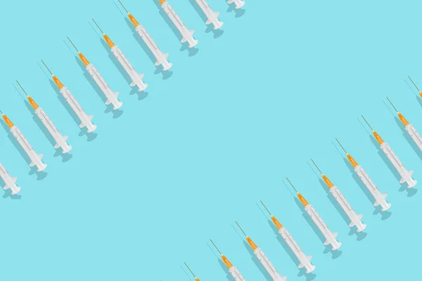 Syringes Isolated Blue Background Copy Space — Stockfoto