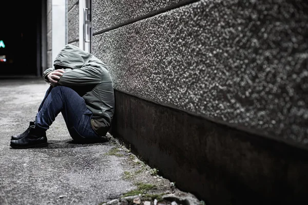 Man Sitting Depressed Dark Alleyway Night His Head Buried His — Foto Stock