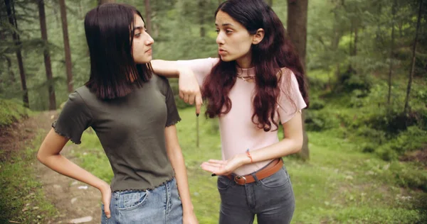 Two Young Women Standing Park Looking Each Other — Zdjęcie stockowe