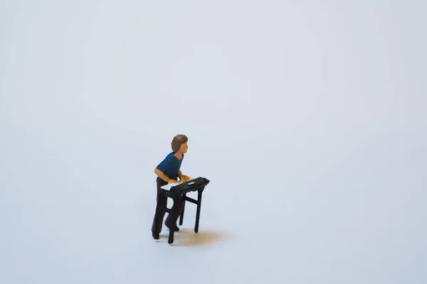 Miniature People Sitting Bench Looking Camera — Photo