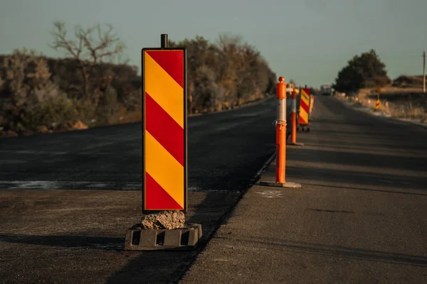 temporary barriers on the road, repair, road construction. flashing beacons