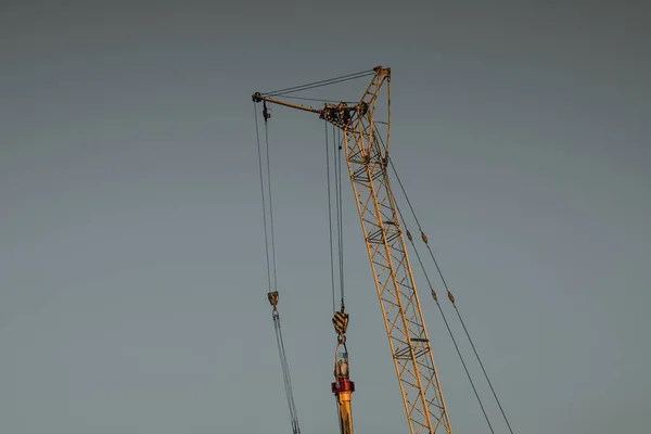 Orange Crane Boom Blue Sky Background — Stok fotoğraf