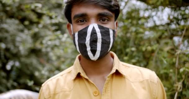 Indian Man Wearing Face Mask Pointing Camera Park — Stock Video