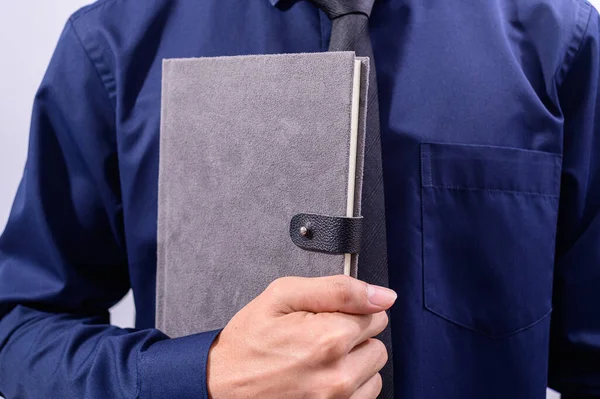 Businessman Holding Closed Planner Gray Cover — ストック写真