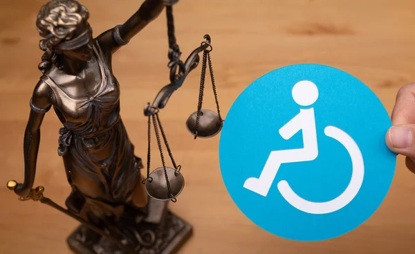 Statue Woman Scales Symbol Law Disabled People Sign Wooden Surface — Stok fotoğraf