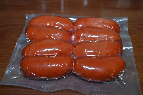 Closeup Shot Packaged Sausages Wooden Table — Fotografia de Stock