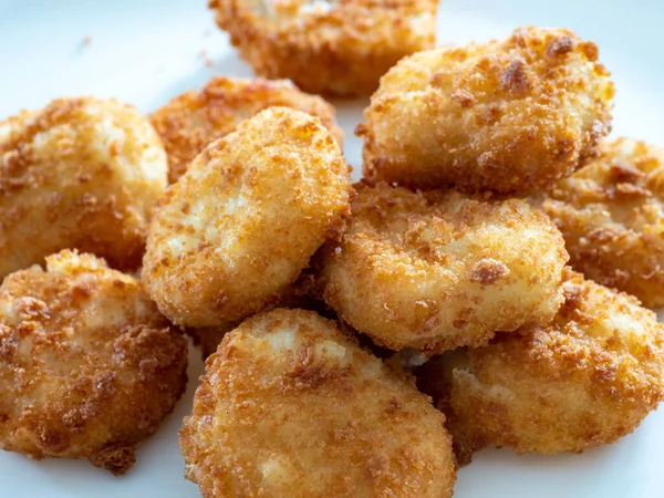 Pile Golden Fried Crispy Chicken Nuggets White Plate — стоковое фото