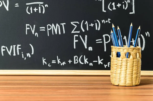 Closeup Shot Pens Basket Blackboard Background — Stock Fotó