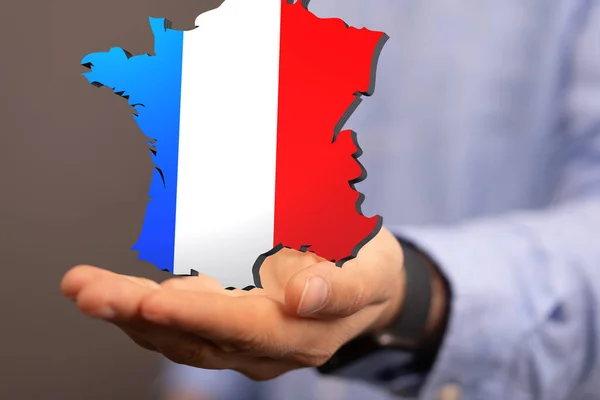 Male Hand Holding Rendered France Map Its Flag Colors — Stockfoto