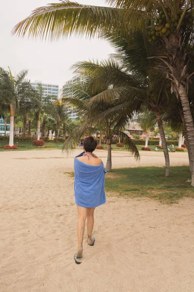 Young woman on the private beach of Punta Centinela in Ecuador