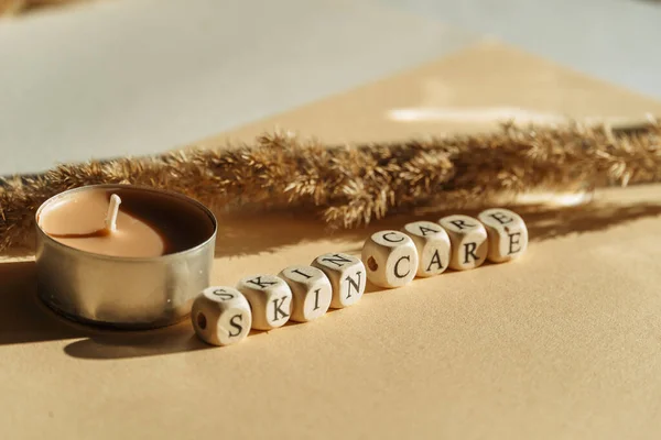 Closeup Wooden Cubes Skin Care Wording Candle Table — Stock Photo, Image