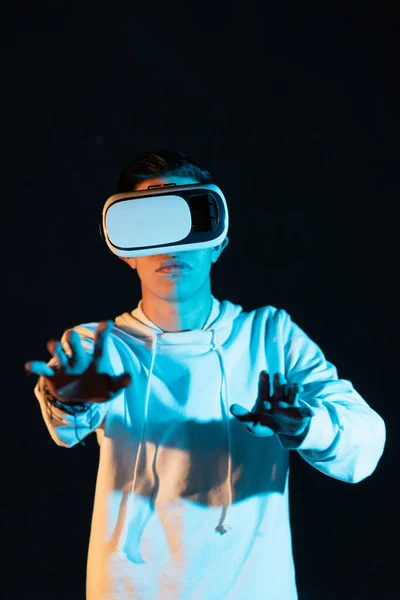 Young Hispanic Male Experiencing Virtual Reality First Time Black Background — Stock Fotó
