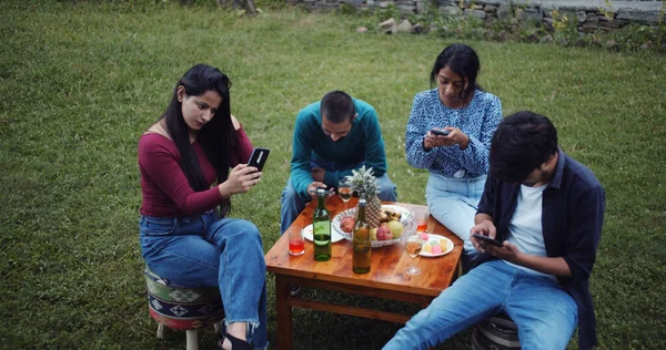 Group Indian Friends Using Phones Front Table Party Garden — стокове фото