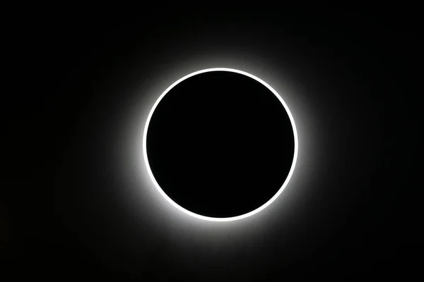 Round lamp covered in the darkness making impression of total eclipse