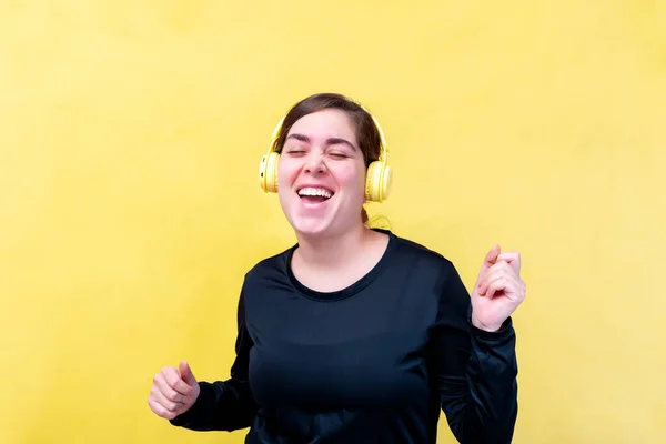 Joyful Caucasian Woman Sings Song Listens Favorite Play List Headphones — Stock Photo, Image