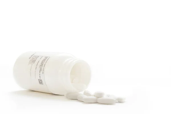 Witte Pillen Een Glazen Pot Een Achtergrond Van Een Licht — Stockfoto