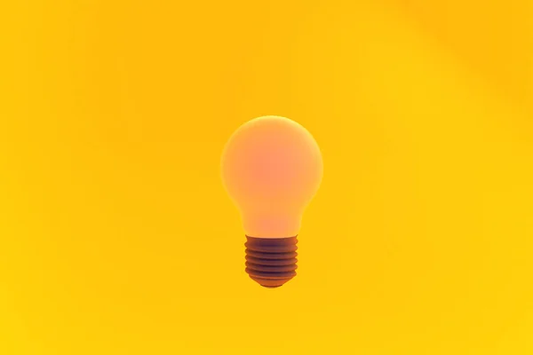 黄色の背景の電球は — ストック写真